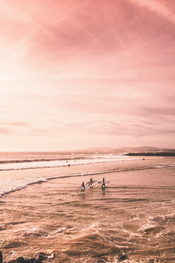 Surfing in cornwall at sunset